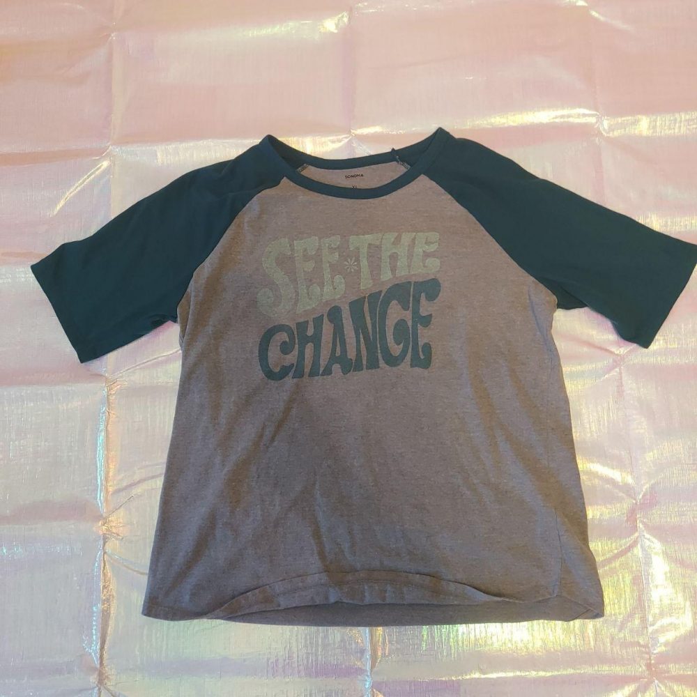 Sonoma grey and teal baseball style tee that says "See the Change"